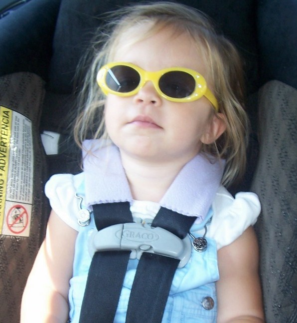 child in carseat w/ strap covers